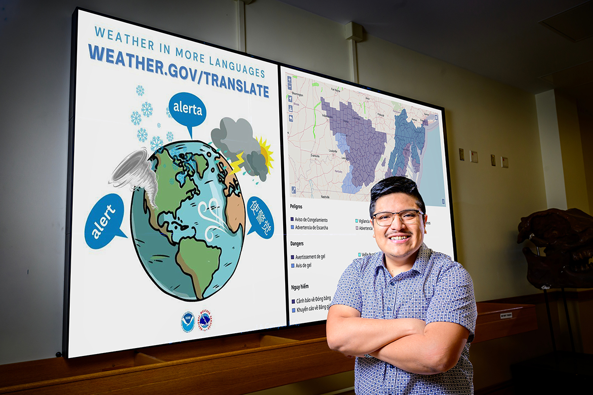 Joseph Trujillo-Falcon standing in front of a screen displaying study graphics
