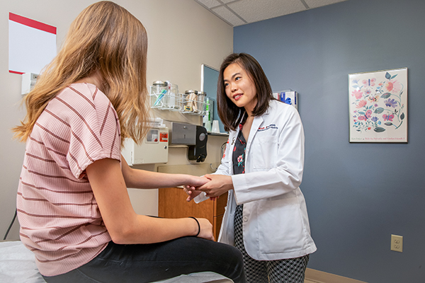 a doctor speaking with a patient