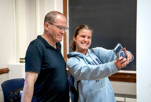 Bill Odenkirk poses with a student for a selfie