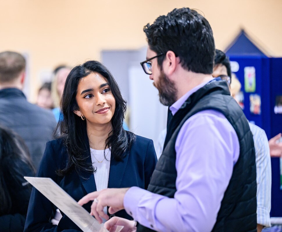student speaking with recruiter