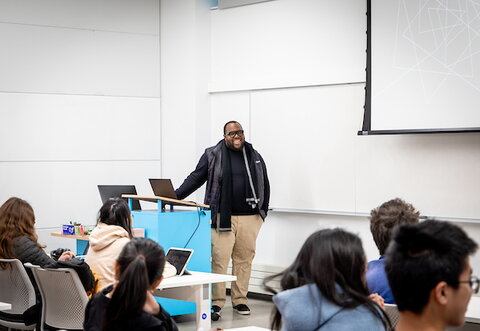 someone speaking to a class or audience