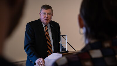 michael mcdonald receives alumni award at a ceremony