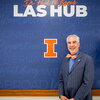 Paul Lisnek poses in front of the entrance to the Dr. Paul M. Lisnek LAS Hub