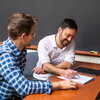 two people going over notes