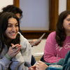 students talking and grinning during a class activity