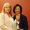 Barbara Hall receives an award from the chancellor