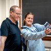Bill Odenkirk poses with a student for a selfie