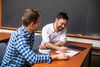 two people going over notes