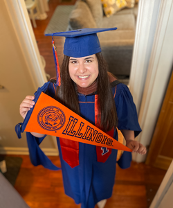 HCOM graduate Arielle Schultz poses in graduation regalia
